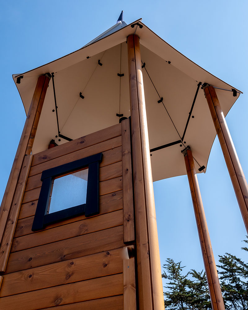 Image looking up at wooden detailing of UniPlay playground systems made out of wood.